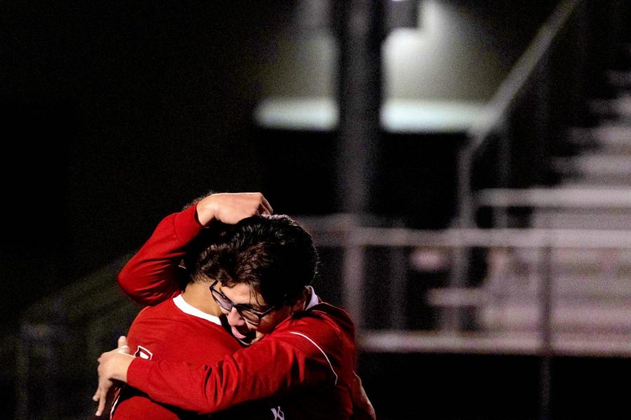 Martin Sanchez hugging Javier Cornejo after victory against Mount Eden.