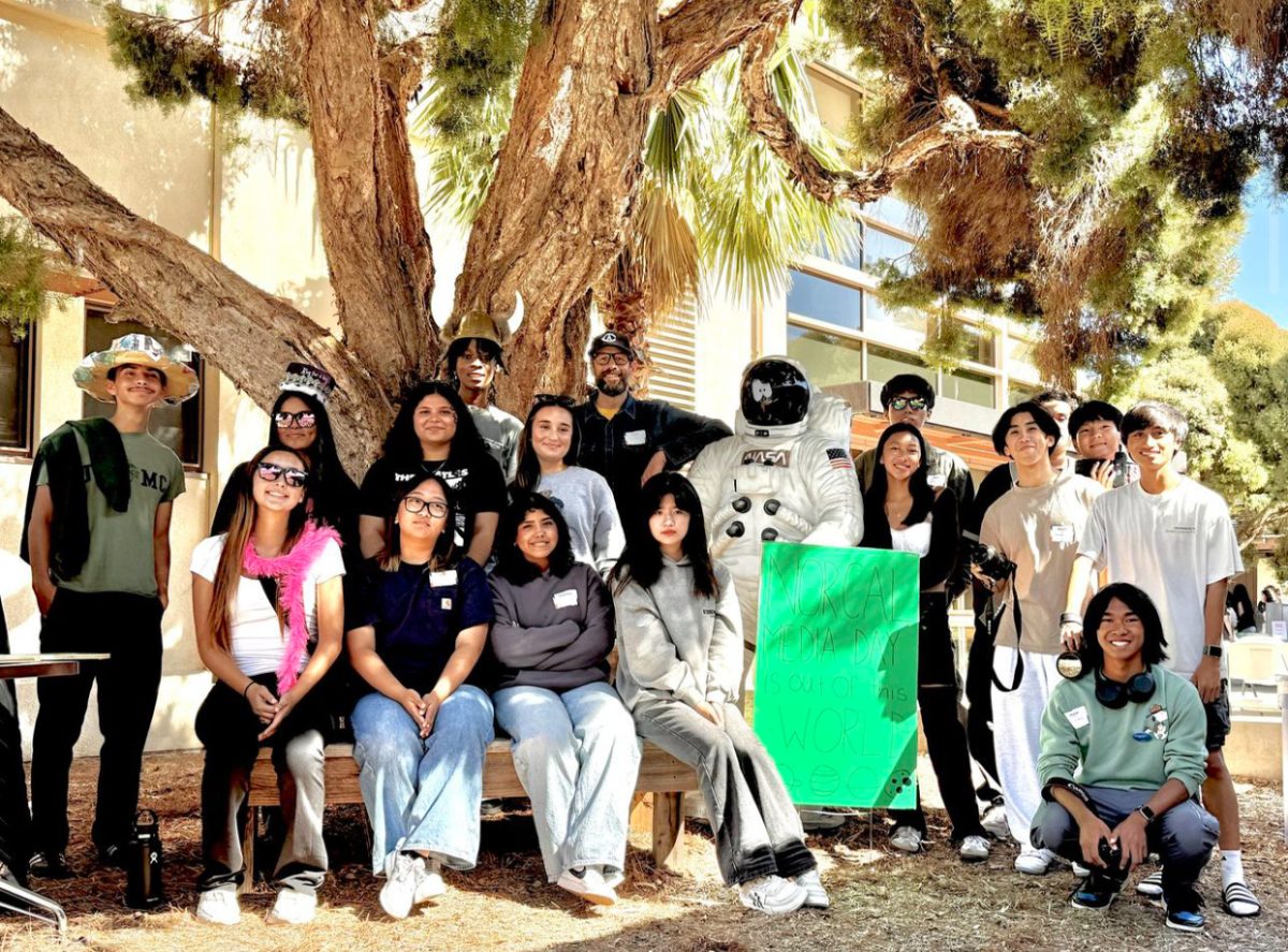 San Leandro publication team poses in front of the Astronaut in Palo Alto High School's quad. 