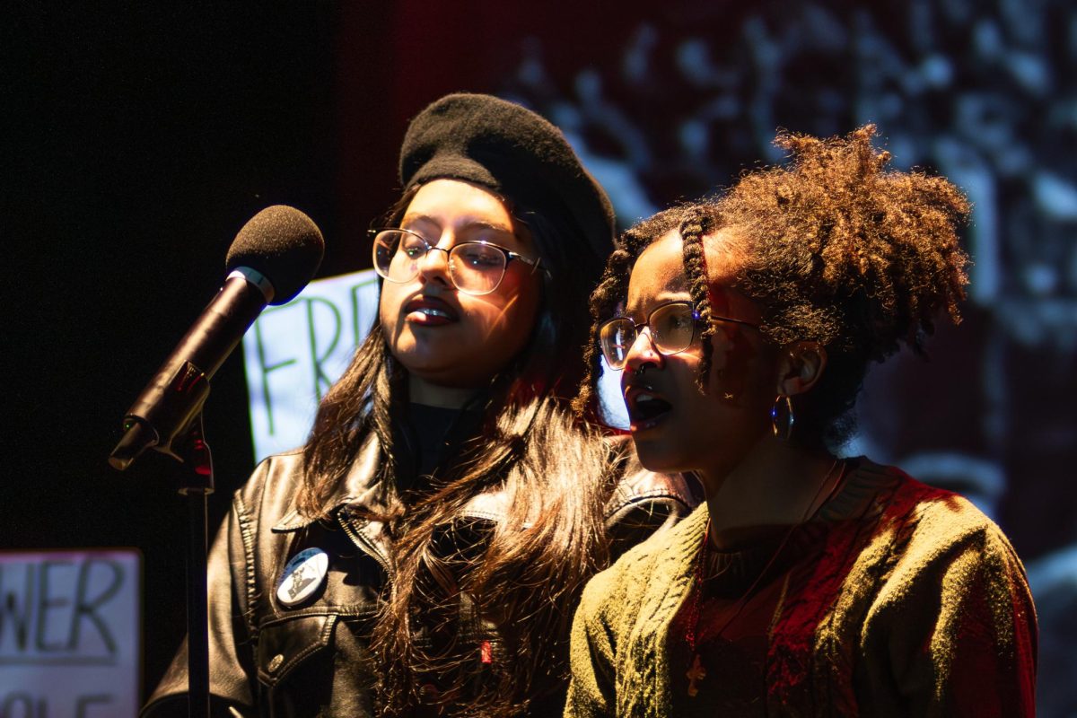 Juniors, Sehinne Yohannes and Victoria Guerra, reciting a poem for their class performance. 