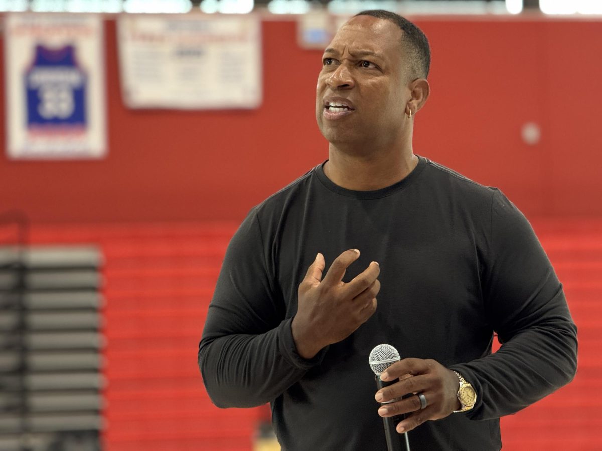 Keith Hawkins, a motivational speaker, uses facial expressions to explain his words of wisdom to the audience of San Leandro High.
